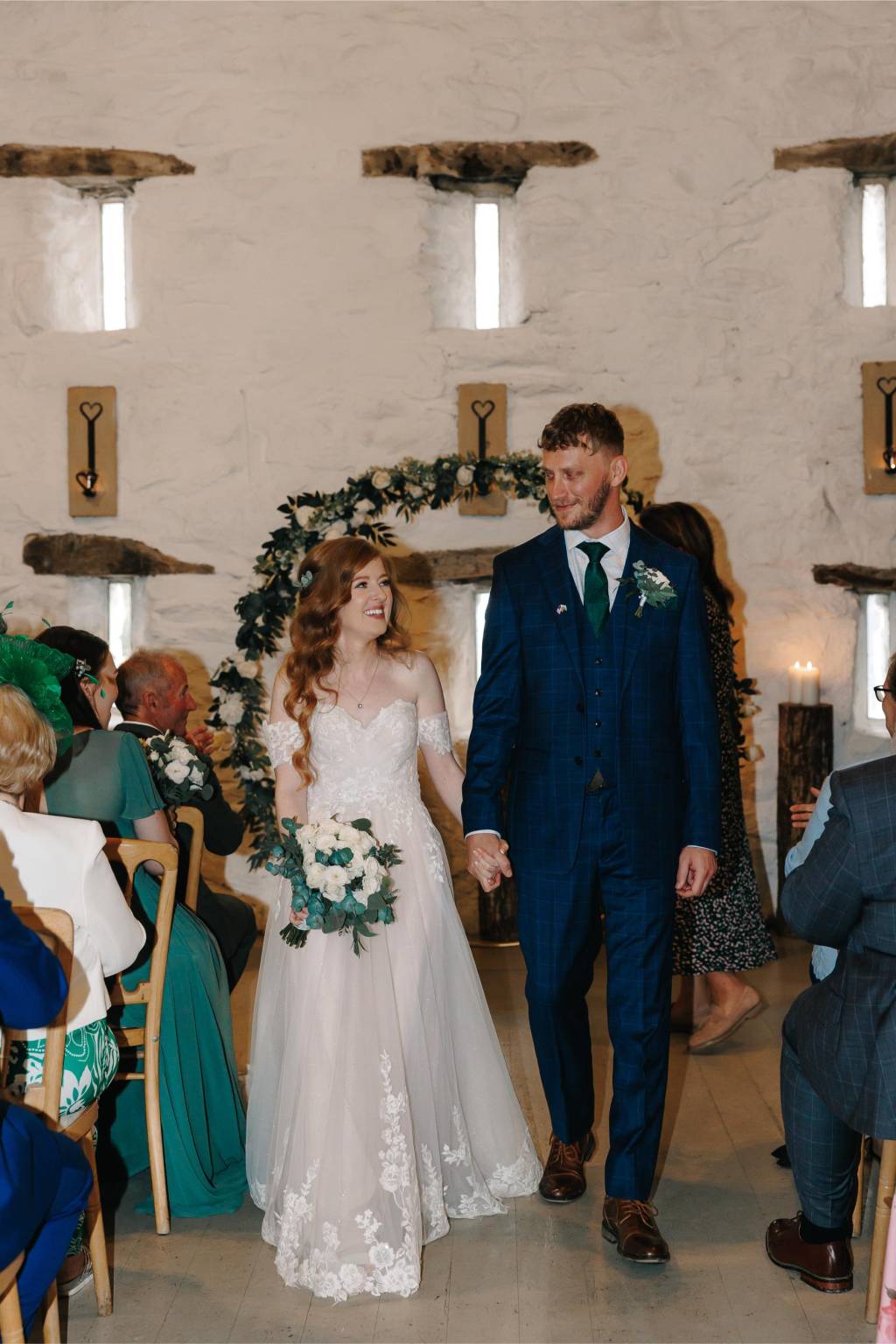 Bride and groom smiling during their ceremony