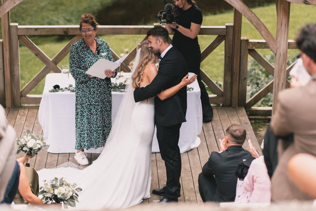 Wedding ceremony on an outdoor wooden deck