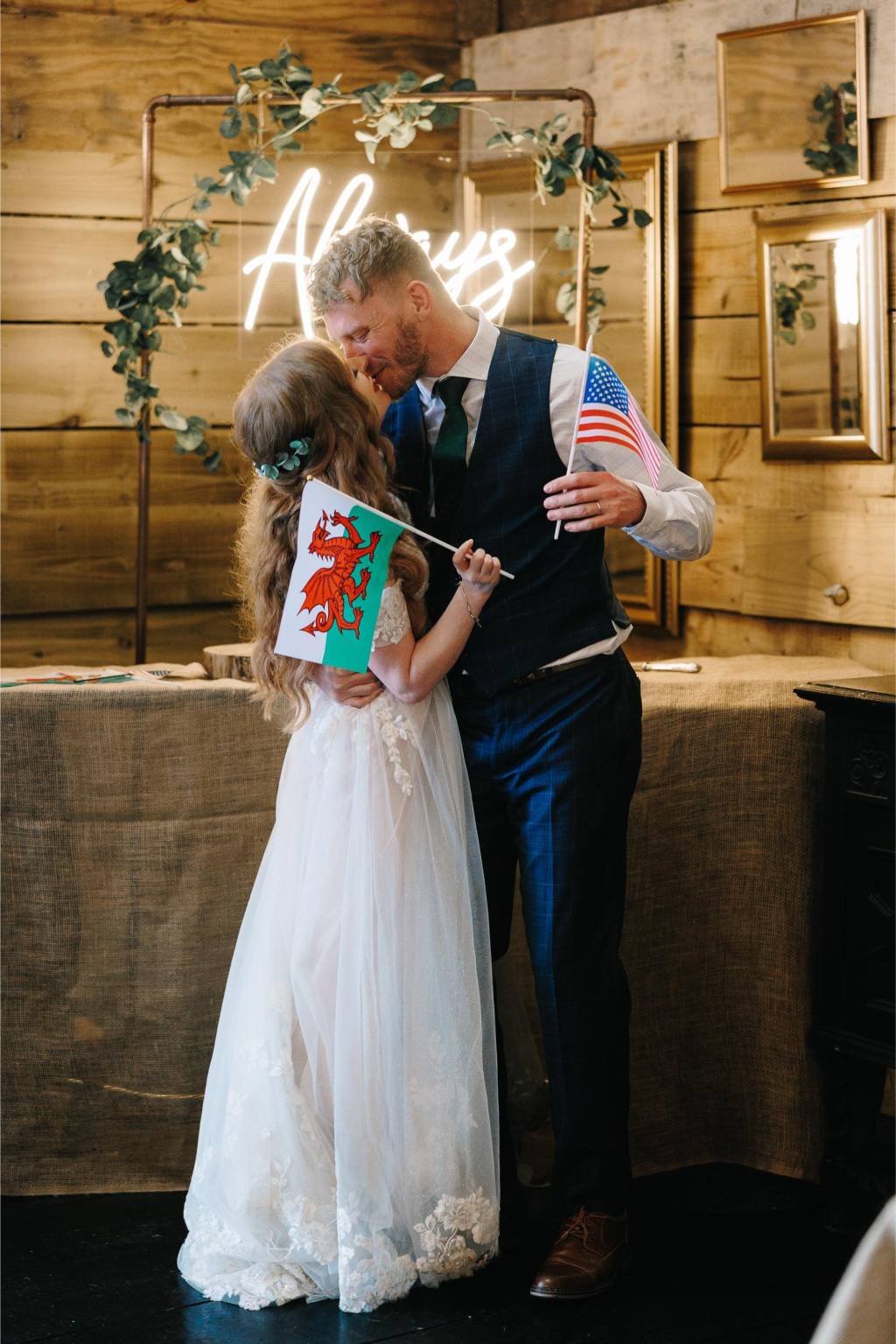 Bride holding a Welsh flag at her wedding