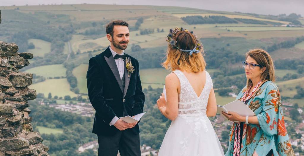 Jane Jones leading an elopement ceremony with views over the North Wales hills