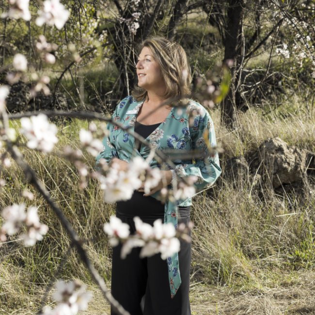 Jane Jones, independent celebrant, among spring blossom