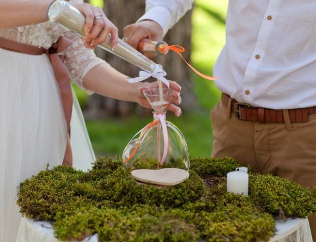 sand ceremony being performed at wedding